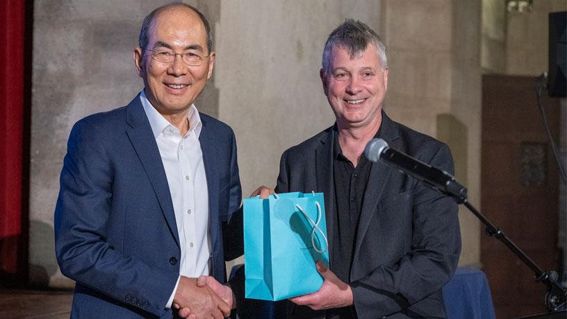 Y. Lawrence Yao (left), professor of mechanical engineering, presented with a gift by department chair, Jim Hone